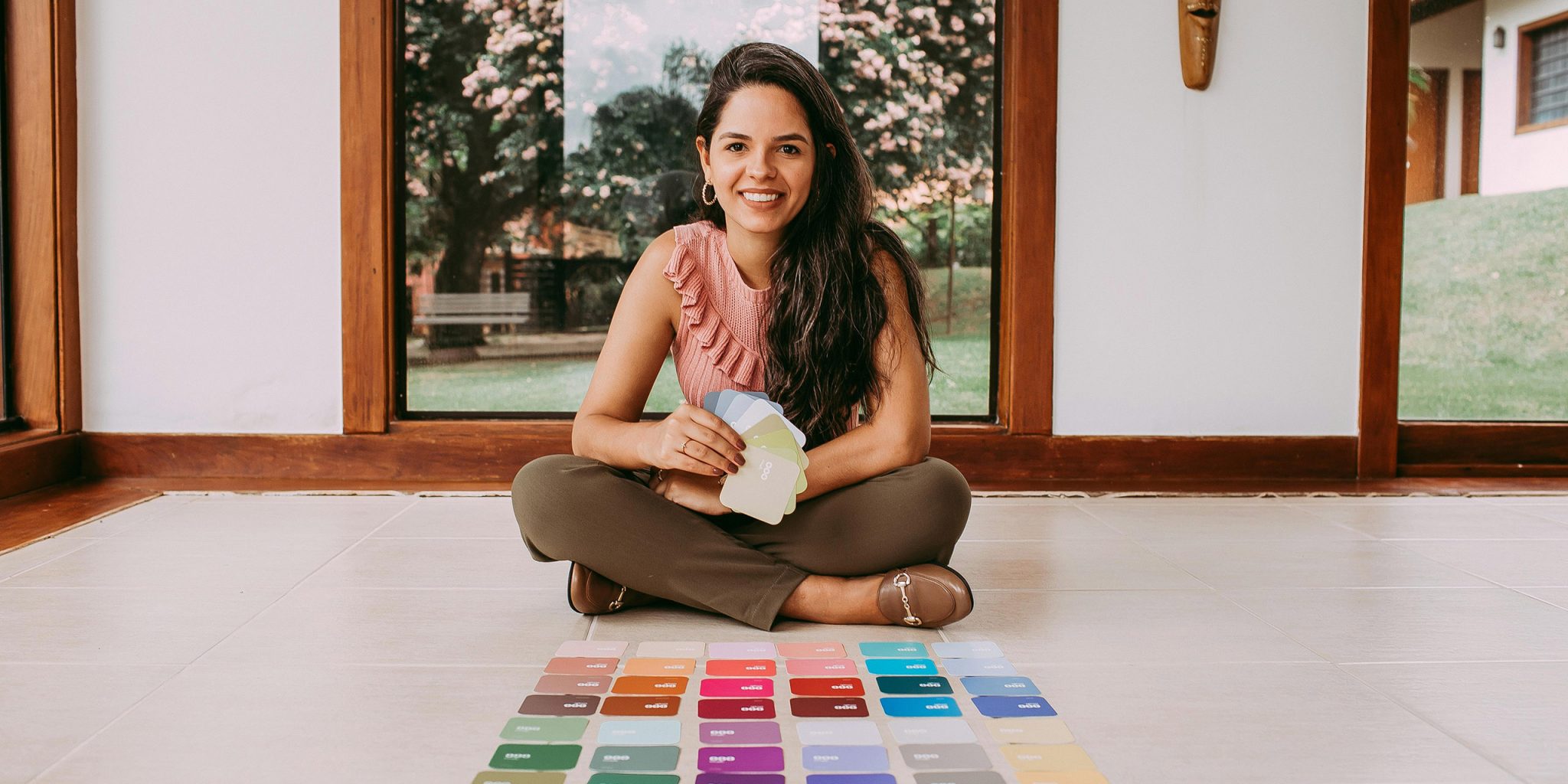 A woman selecting brand colours. This is an intro to my article "How many colours should a brand have"