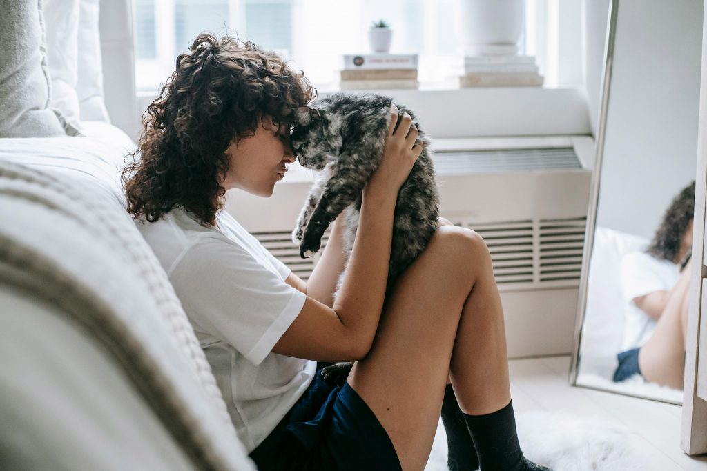 Woman cuddling a cat as an introduction to an article called "Why It’s Important to Identify Your Target Audience in Branding"